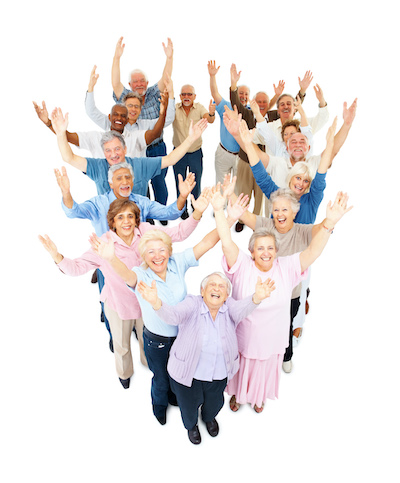 Aerial view of a group of seniors with their arms extended to the sky